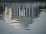 A Serene Reflection of the Jefferson Memorial in the Tidal Basin