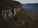Cliffs Rise Above the Autumn-Colored Valley Floor