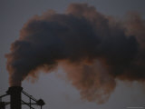 Plumes of Dark Smoke are Released into the Air from a Smokestack