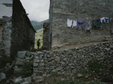 A Hiker Walks Between Houses in the Coruh Valley Region