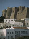 Large Stone Walls Surround a Monastery in a Greek Village