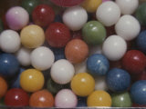 Close View of Colorful Gumballs in a Vending Machine