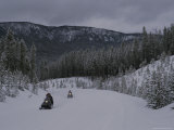 Snowmobilers in Yellowstone National Park  Wyoming