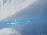 Little Icicles Drip Water on a Sunny Day Above the Arctic Circle