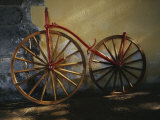An Antique Bicycle Rests against a Wall