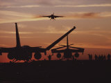 Silhouetted Planes on an Aircraft Carrier at Twilight