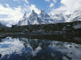 A View of the Fathi and Other Peaks Reflected in a Pond