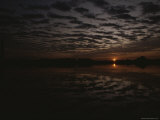 A Dramatic Twilight View of a Cloudy Sky and Water with Reflections
