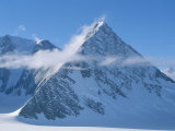 A Cloud Passes by Windblown Pyramid Peak  in Antarctica