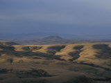 In the Distance  a Lone Butte Rises out of the Surrounding Hills