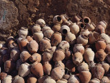 Terra Cotta Squid Pots Stacked against a Wall in a Portuguese Village