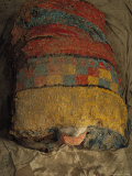 Bright Macaw Feathers Adorn the Front of a 1300-Year-Old Mummy Bundle