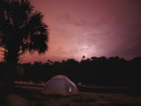 Lightning Splits the Dawn Sky Above a Campsite on the Peace River