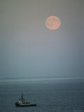View of the Moon over the Sea and a Fishing Boat