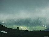 Hikers Descend the 8316-Foot-High Pass under a Cloudy Sky