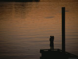 Lovers in an Embrace at Sunset on a Pier over Victoria Harbour