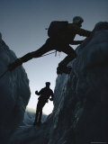 A Climber Straddles a Shallow Crevasse
