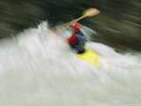 A Kayaker Paddles Through the Rapids of Kicking Horse River