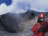 A Scientist is Seen Photographing a Crater on Mount Etna