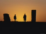 Silhouetted People at Sunset at an Old Desert Telegraph Station