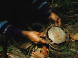 A Burmese Man Holding a Steel Animal Trap in His Hands