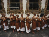 Buddhist Monks Share a Meal in a Courtyard at Wat Po; Wat Po is Bangkoks Oldest and Largest Temple