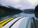 A Row of Canoes on an Emerald Lake Dock