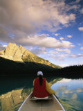 A Canoeist Paddles Across Emerald Lake in Yoho National Park