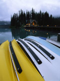 A Row of Canoes on an Emerald Lake Dock