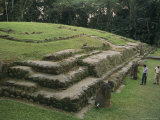 Two People Explore an Ancient Mayan Pyramid Ruin