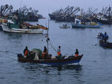 Peruvian Fishermen Head out to Their Anchored Boats off Shore