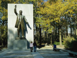Bronze Statue of Theodore Roosevelt with Yellow Oak Leaves and Nearby Couple