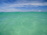 Clear Blue Water and Wispy Clouds Along the Beach at Cancun
