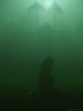 A Woman Praying in a Temple
