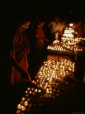 Tibetan Buddhist Monks Light Yak Butter Lamps at a Full Moon Ceremony
