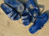 Blue Plastic Sandals  Covered in Sand  Lie on a Beach in Hong Kong