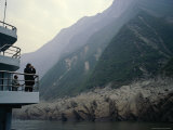 Tourists Take Photos from a Riverboat as It Passes the Three Gorges