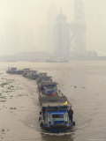 Barges Ply the Huang Pu River in Front of the Pudong New Area