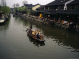 Tourists in a Traditional Boat on One of Zhouzhoungs Many Canals