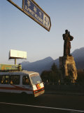 Bus Passes by the Statue of Damo at the Entrance to Shaolin