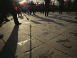 During a Fan Dance  Old Men Paint Chinese Characters on the Pavement