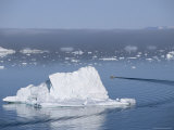 Fishing Boat Maneuvers Around Icebergs near the Ilulissat Glacier