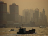 Barges and a Ferries in Victoria Harbour with Shun Tak Centre