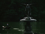 A Gondola Glides Past the Bronze Angel of the Waters Fountain  Sculpted by Emma Stebbins
