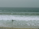 A Surfer Faces the Atlantic Waves in a Moroccan Surf Town