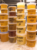 Plastic Containers of Honey are Sold at a Food Market