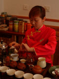 A Salesperson Prepares Samples of Tea for Tourists