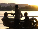A Waiter Serves Drinks Aboard a Sunset Cruise on the Nile River