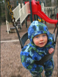 Baby on a Swing at a Playground