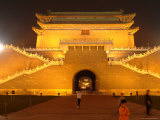 Children Play Soccer in Front of a Floodlit Gate on Tiananmen Square